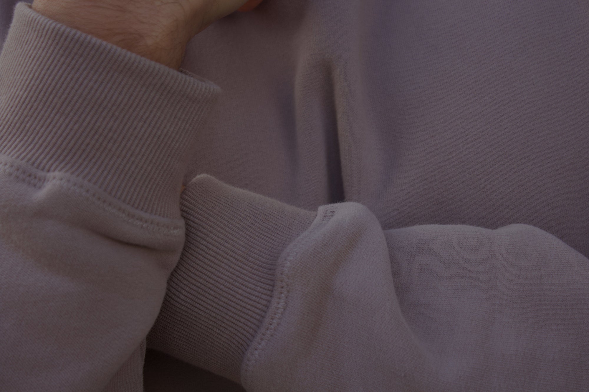 A close up picture of a sweatshirt's ribbed cuffs.