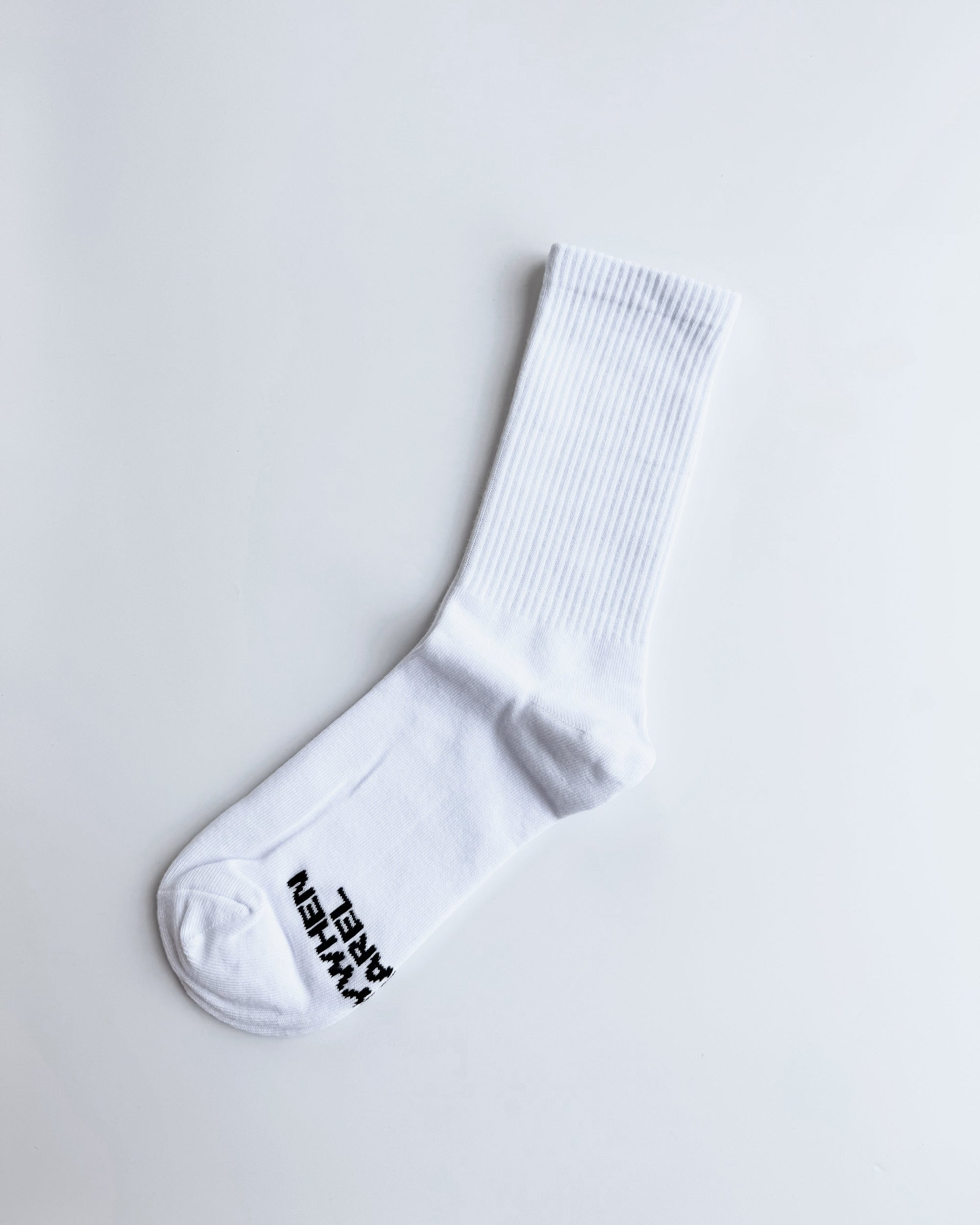 White sock with black text on a light gray background