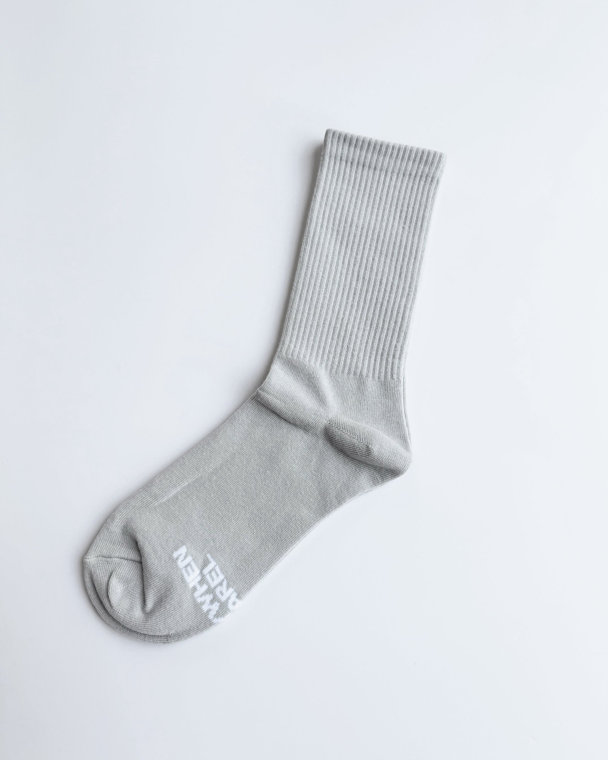 Gray sock with a brand logo on a light gray background