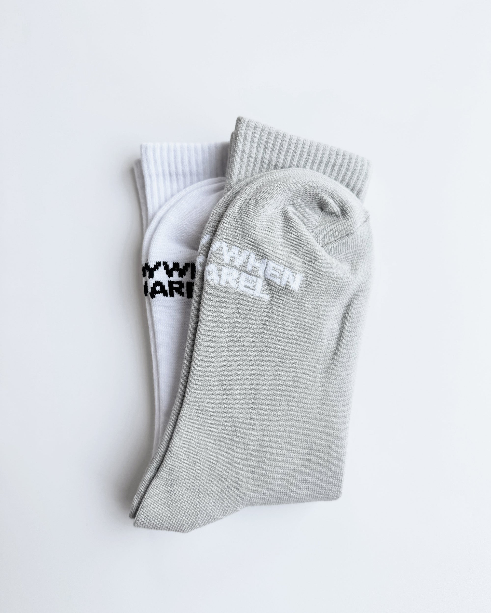 Gray and white socks with text on a light gray background